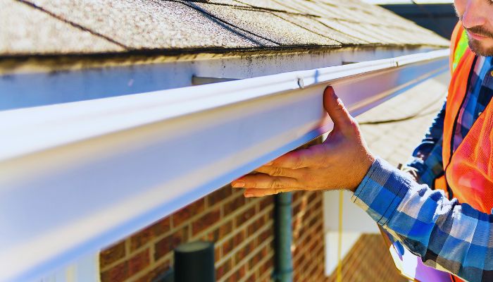 Man checking roof 