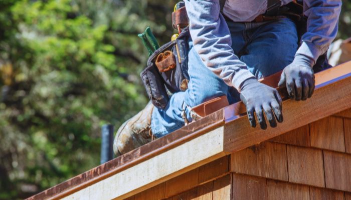 man repairing roof 