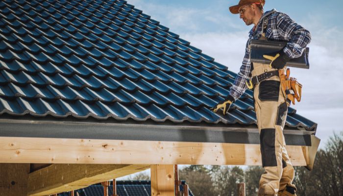 worker checking roof 