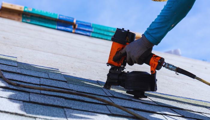 man trying to install roof 