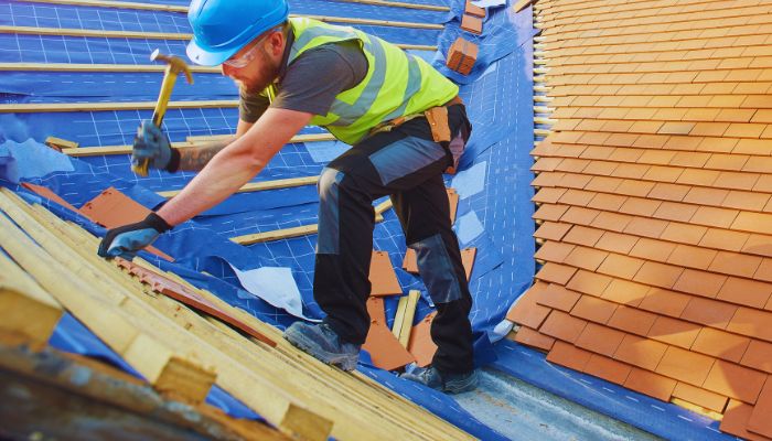 man changing roof 