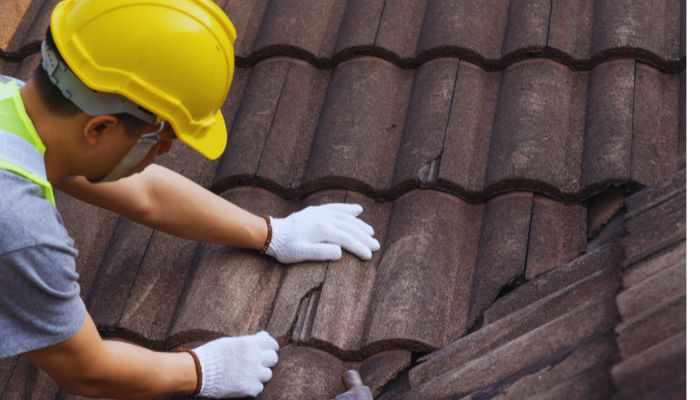 man fixing roof 