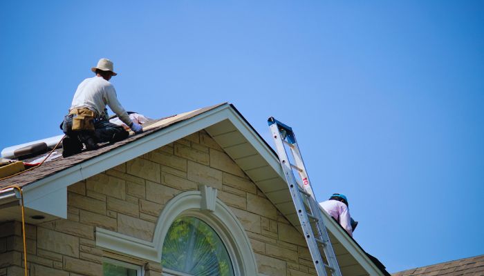 emergency worker applying roof 